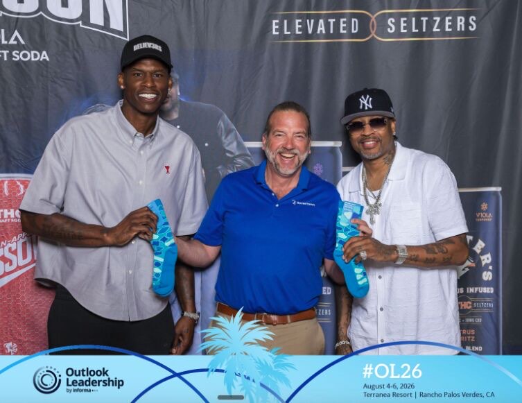 Two conference guests holding Rovertown socks at the Rovertown photo booth